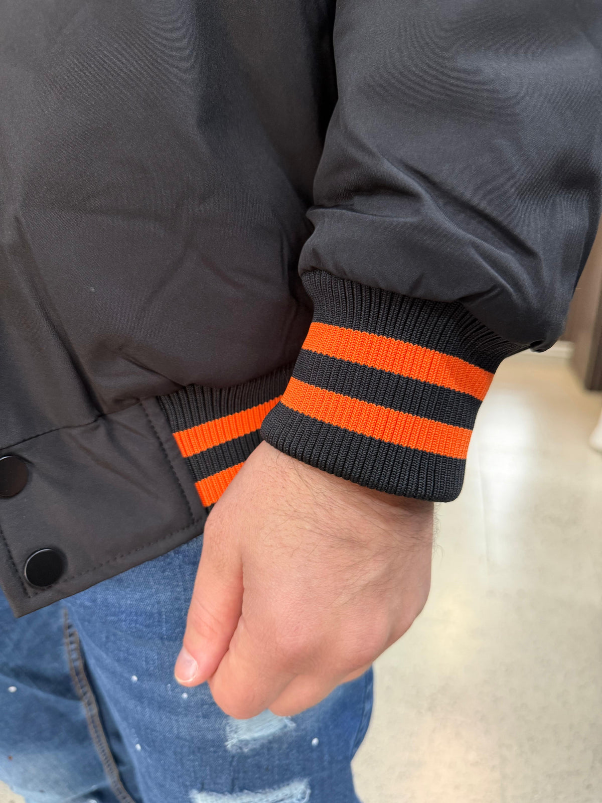 Collegejacke mit Kapuze und H-Logo